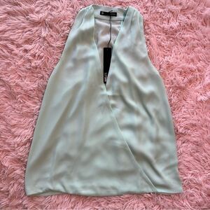 Karisa Surplice Tank in color Myth NWT size XS